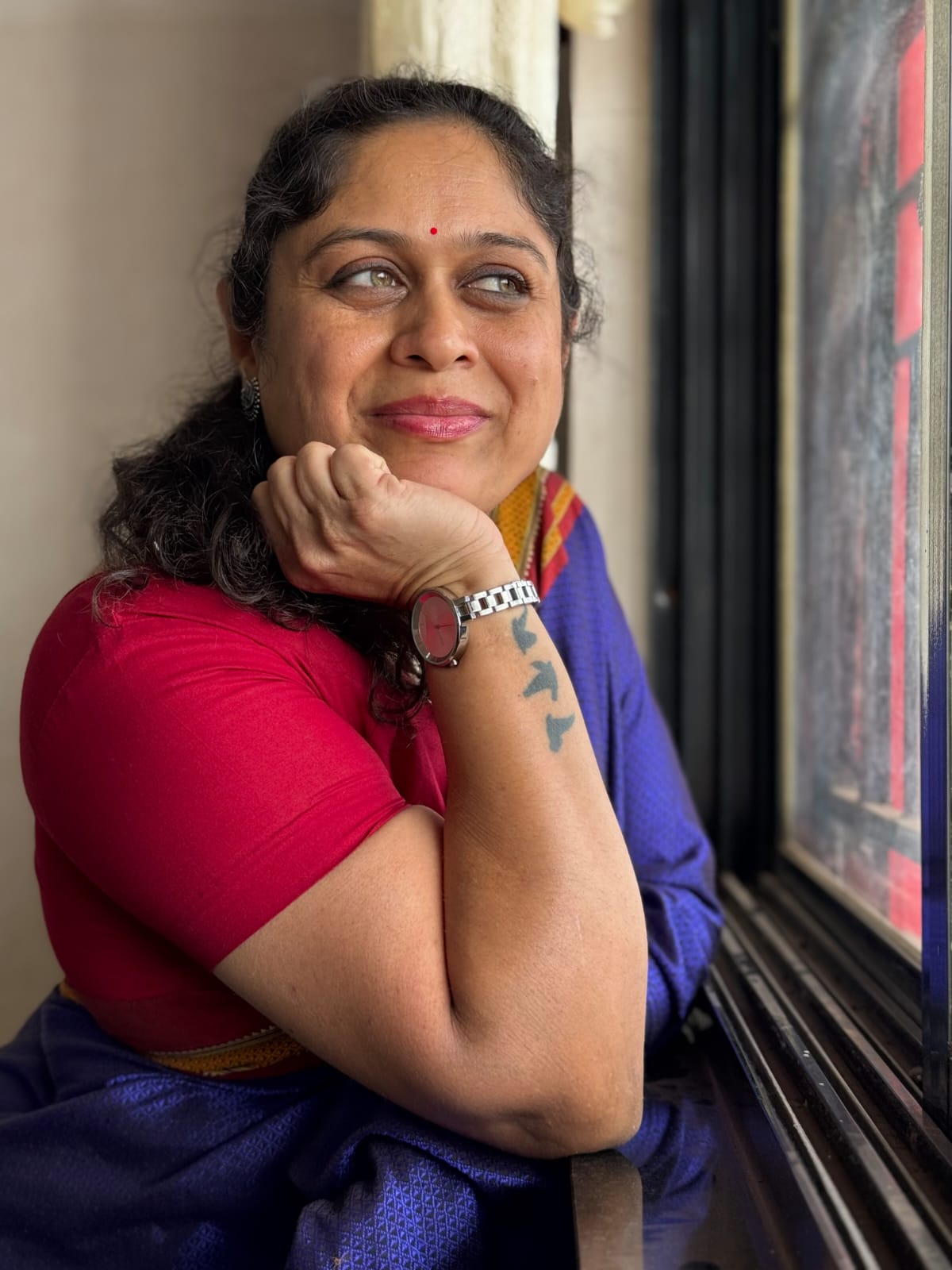 Mayuri Apte Jejurikar thoughtful portrait by window